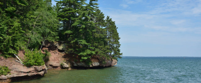 A rocky shoreline on a large lake