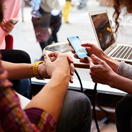 Two people using a smart phone