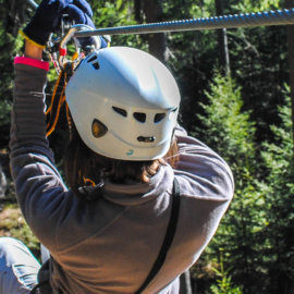 A person starting down a zipline