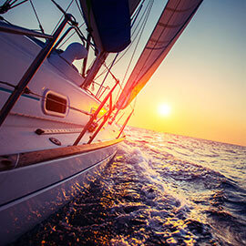 A sailboat careening into the sunset