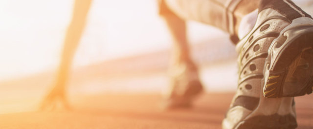 A track runner at the starting line