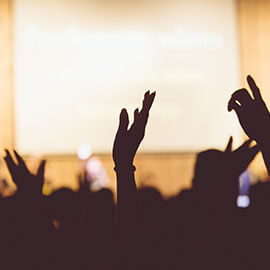 Hands being raised at a church