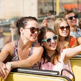 Girls in a park ride wearing sunglasses