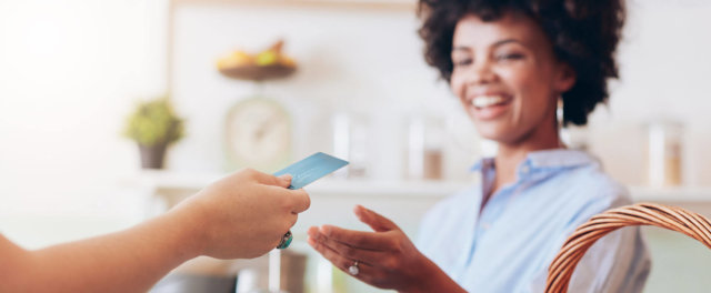 A woman shopping with a credit card