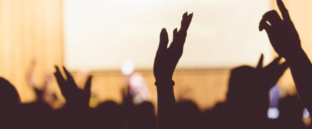 Hands being raised at a church