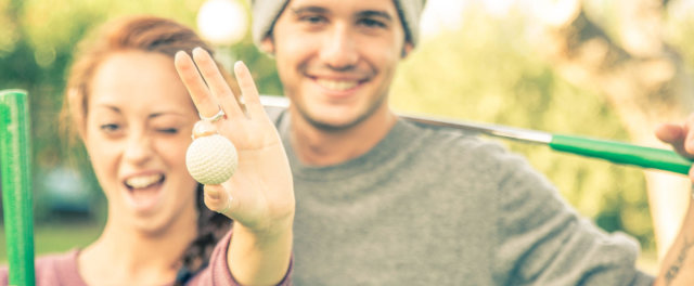 A couple at a mini golf course