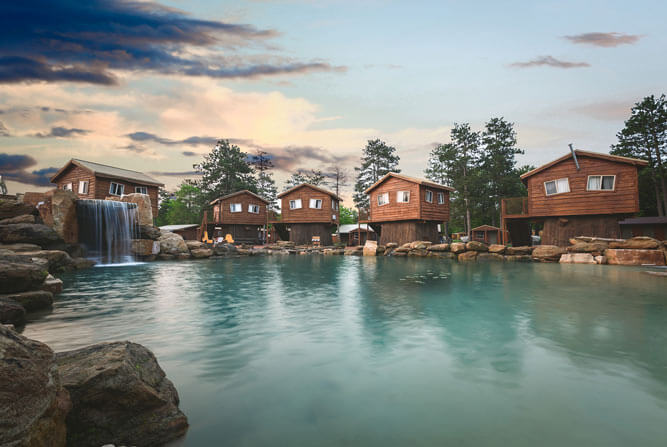 American Resort & Treehouses view from across the Natural Lagoon